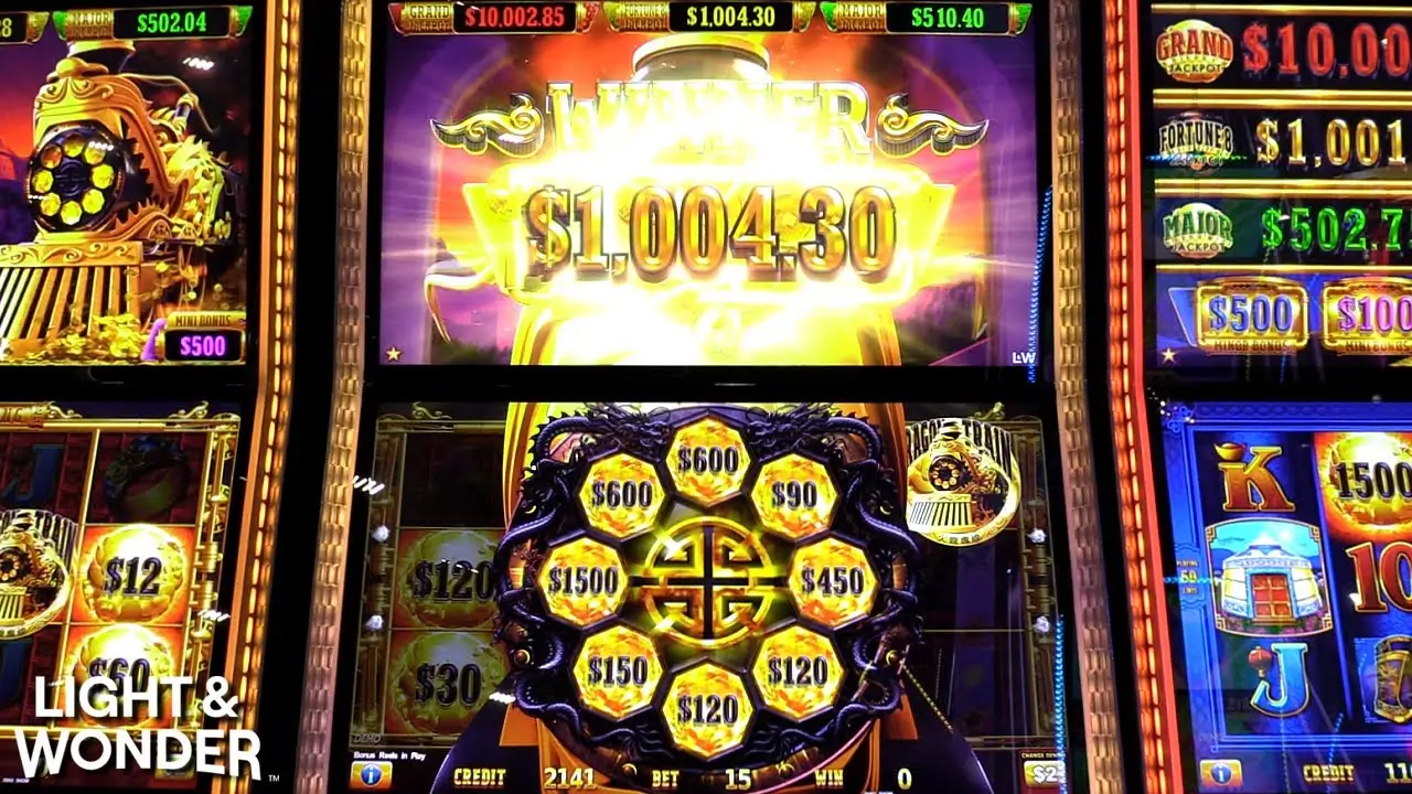 Dragon Train Pokies winning screen showing bright jackpot display and golden bonus wheel values